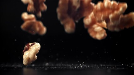 Poster - Walnuts fall on the table. Filmed on a high-speed camera at 1000 fps. High quality FullHD footage