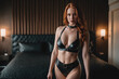 © SOLOTU - Young bdsm style red hair sexy woman portrait in black latex suit or lingerie. Generative Ai