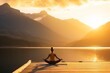 yoga practitioner on pier with mountain lake at golden hour