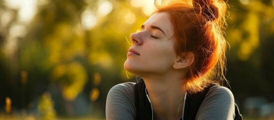 Poster - Red-haired woman in sports attire taking a break and catching her breath after a run outdoors.