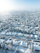 Snow-covered suburban houses seen from above