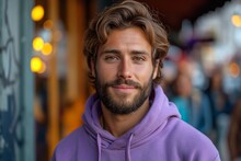 A Young Confident Bearded Caucasian Man Wearing Lilac Hoodie Against Blurred Background