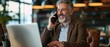 © khwanchai - Happy smiling mature middle aged business man, 40s professional lady executive manager talking on a cell phone making business at work in office