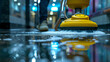 © Jammer Gene - Floor scrubber cleaning the floor, with chemicals, low angle.