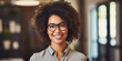 smiling attractive African American businesswoman in an office background with a positive vibe 