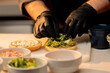 © Guys Who Shoot - close-up professional kitchen in the hotel restaurant chef prepares the ingredients for the burger