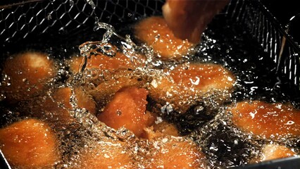 Poster - Chicken nuggets are fried in oil. Filmed on a high-speed camera at 1000 fps. High quality FullHD footage