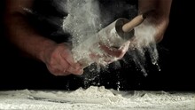 Chef With A Rolling Pin In His Hands And Flying Flour. Filmed On A High-speed Camera At 1000 Fps. High Quality FullHD Footage
