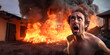 a frightened man on the background of the rubble of a house destroyed by fire