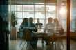 © ASDF - people sitting around a table at a conference room
