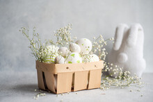 Easter Eggs With Delicate Gypsophila In A Wooden Basket