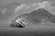 Shipwreck On Secluded Black And White Beach - North Coast