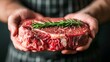Artful butcher expertly showcasing craft with precision, handling succulent marbled raw beef steak