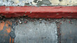 Weathered wall with layers of old red paint peeling away.