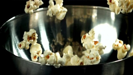 Sticker - Popcorn drops into a big bowl. Filmed on a high-speed camera at 1000 fps. High quality FullHD footage