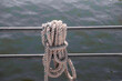 Sesal rope coiled on the handrail of a boat