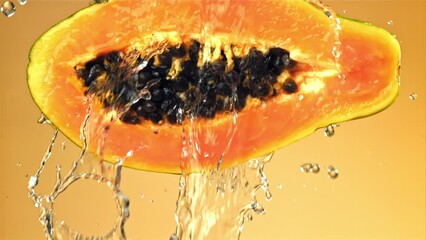 Sticker - Fresh tropical papaya with drops and splashes of water. Filmed on a high-speed camera at 1000 fps. High quality FullHD footage