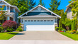 Garage door background. A typical American white garage door with a driveway in front