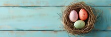 Colorful Easter Eggs In A Nest On A Wooden Table, Overhead Photo For Easter Holiday