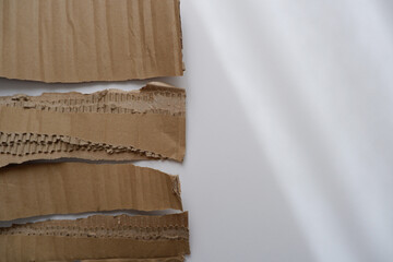 Torn cardboard paper for using as a text box. torn cardboard paper for background and design material.