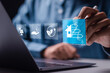 © Pakin - Energy efficiency concept. Businessman use laptop with virtual screen of energy efficiency rating for energy efficient house building rate label audit.