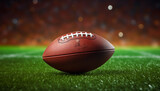 Fototapeta Sport - American football ball on green artificial stadium