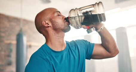 Wall Mural - Fitness, water and black man in gym with bottle on workout break to relax at morning challenge routine. Drink, rest and sweat, tired athlete at exercise club for health and wellness at power training