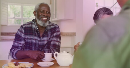 Sticker - Image of light spots over diverse group of seniors talking