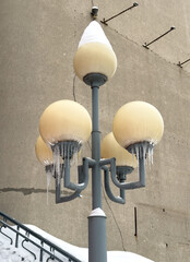 Wall Mural - Street lamp in icicles in winter