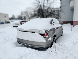 Wall Mural - Car covered with white snow