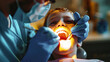Dentist Examining Young Boys Teeth