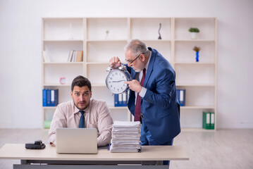 Wall Mural - Old male boss and young male employee in bullying concept