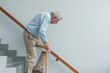 © Image forest - Old man going down the stairs with a cane