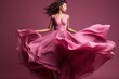 © Jam - Woman in pink dress, fashion model in long silk dress fluttering in the wind, fantasy girl in flying fabric