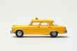 © Artem - Yellow taxicab retro toy collectible item. Created with Generative AI technology