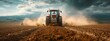 Tractor Plowing Field at Sunset, Dust Trail in Agriculture Landscape
