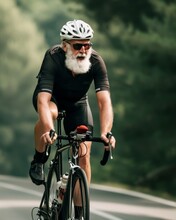 An Old Man With A White Beard, Wearing Cycling Gear, Riding A Road Bike On A Picturesque Country Lane