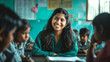 smiling indian female teacher in focus and students in foreground
