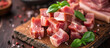 cubes of bacon on a rustic wooden board