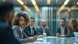 © visoot - Team of diverse businesspeople having a meeting in a transparent boardroom. Group of business professionals having a discussion during a briefing. Generative AI.