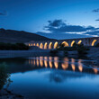 © mindstorm - iran ancient bridge over river at blue hour night.