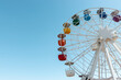 © Paopano - Old colorful ferris wheel on background of blue sky.