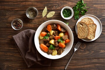 Wall Mural - Beef meat stewed with potatoes, carrots and spices