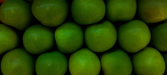 makassar, indonesia asia, february 2 2024 neatly arranged green apples for sale in a shop