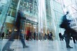 © Anastasiia S - photo of the business centr from the outside, motion blur people passing
