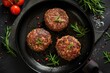 Organic beef hamburger patties with spices in a frying pan. Top view.