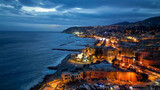 Fototapeta Mosty linowy / wiszący - Aerial view of Sanremo at night, Italy. Port and city buildings