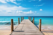 Wooden Jetty Over The Clean Blue Sea Or Ocean On Tropical Beach On Sunny Summer Day