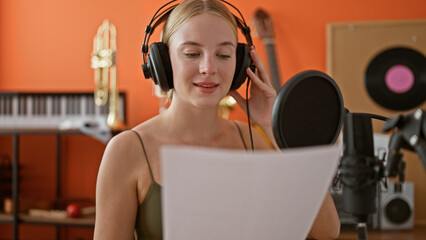 Canvas Print - Young blonde woman musician smiling confident singing song at music studio