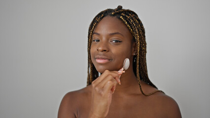 Poster - African american woman smiling confident massaging face with skin gym over isolated white background